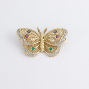 Brosche als Schmetterling mit Diamanten und echten Steinen.